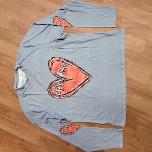 Loose fitting silky football tee
